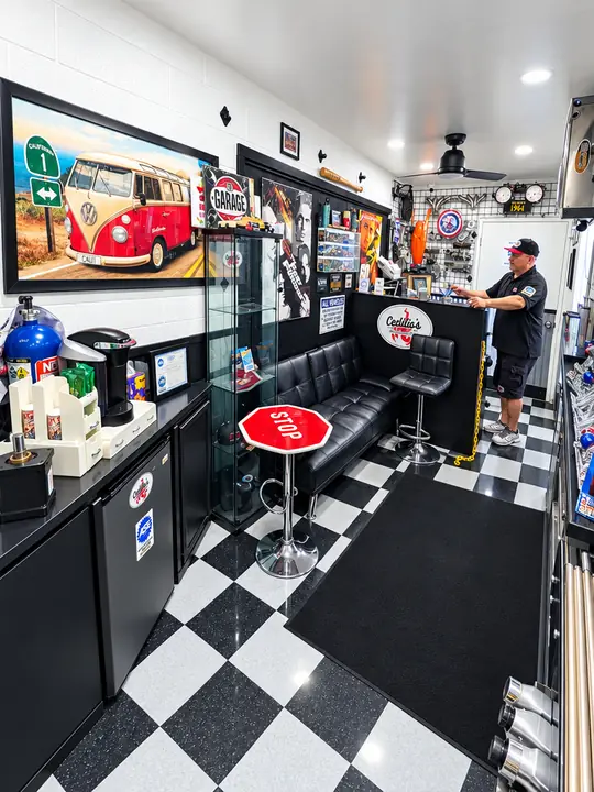 Cedillo's waiting area with classic VW bus artwork, leather bench and counter in Fullerton